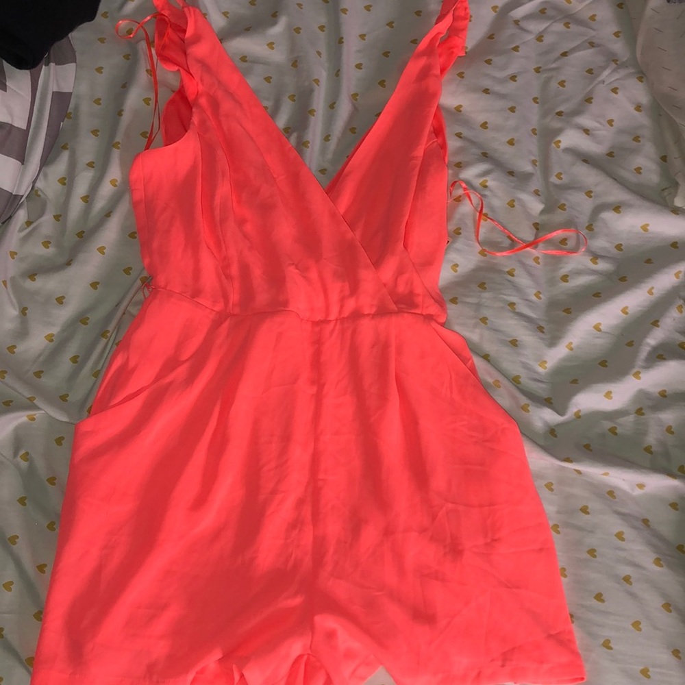 Romper. Never worn.